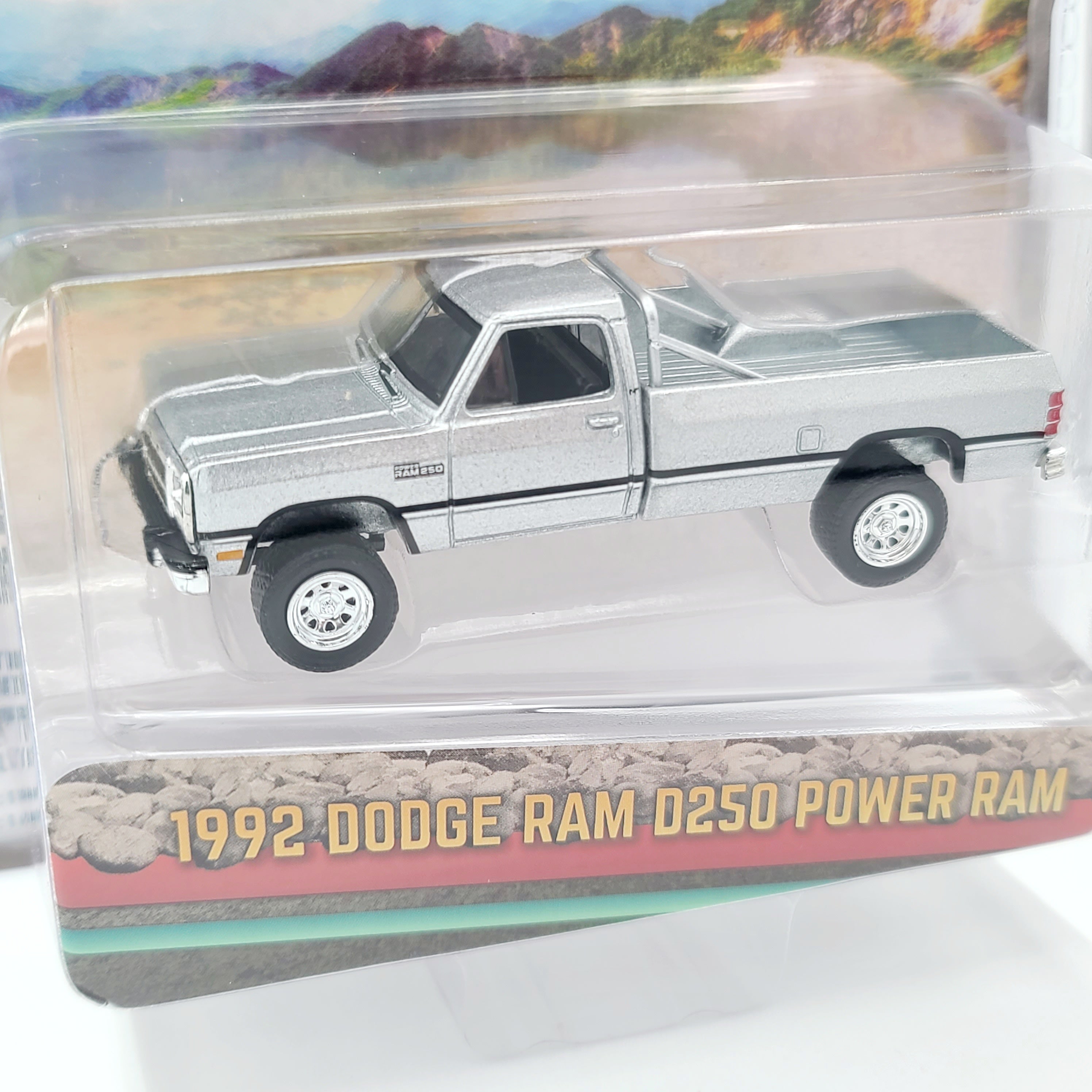 GreenLight '92 Dodge Ram D250 Power Ram Lifted w/ Rollbar - 1:64 scale, Sterling Silver (2024 All Terrain Series 16)
